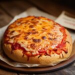 A Pizza Lunch Loaf is a fun, hearty twist on traditional pizza! It’s made by stuffing a loaf of bread or pizza dough with your favorite pizza toppings, then baking it to golden perfection. Perfect for lunch, parties, or game day, this recipe is customizable with endless topping combinations.